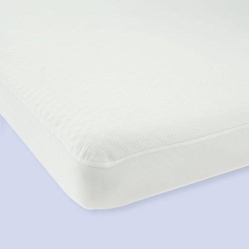 White breathable mattress with seamless corners on a light blue background.