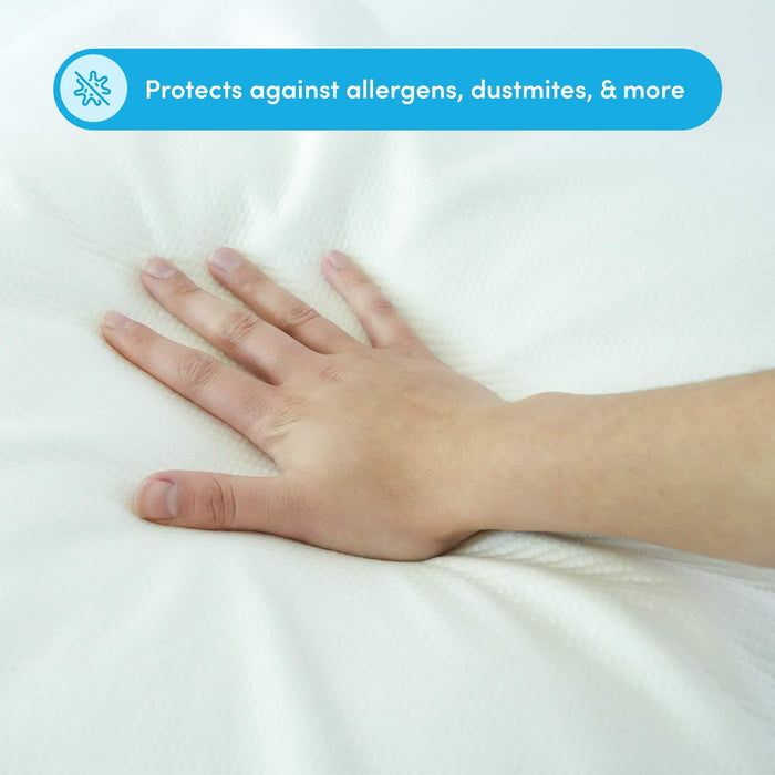 Hand touching hypoallergenic mattress protector surface, guarding against allergens and dust mites.