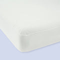 Orthopedic memory foam mattress with white cover for optimal sleep comfort.