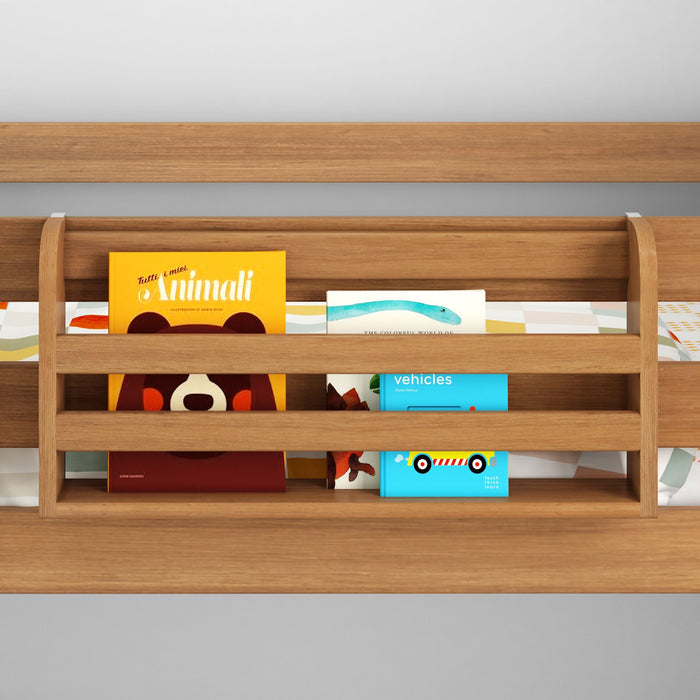 Wooden children's bookshelf displaying colorful picture and board books on a nursery wall