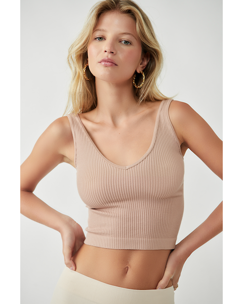 Woman in Almond brami tank on light background