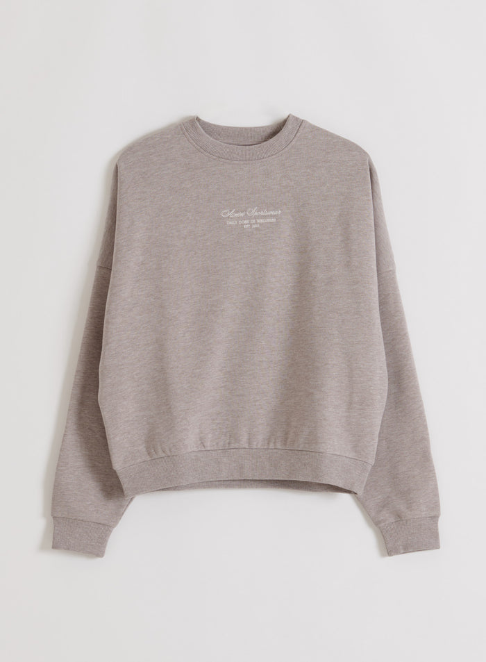 Espresso Melange Script Sweatshirt pehmeästä meleeratusta kankaasta valkoisella aim'n-logolla.