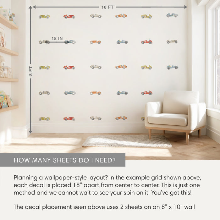 Vintage race car wall decals in a kids' nursery arranged in a wallpaper-style grid on an 8×10 ft cream wall with 18-inch spacing, cozy armchair, floating shelves and window