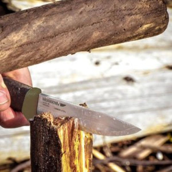 Morakniv Companion Heavy Duty OD Green cutting wood, custom kit builds, top outdoor brands, A Way Through the Wilderness