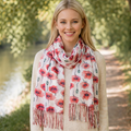 Woman wearing a floral poppy scarf in a park setting