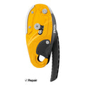 Yellow and black Petzl climbing device on a white background