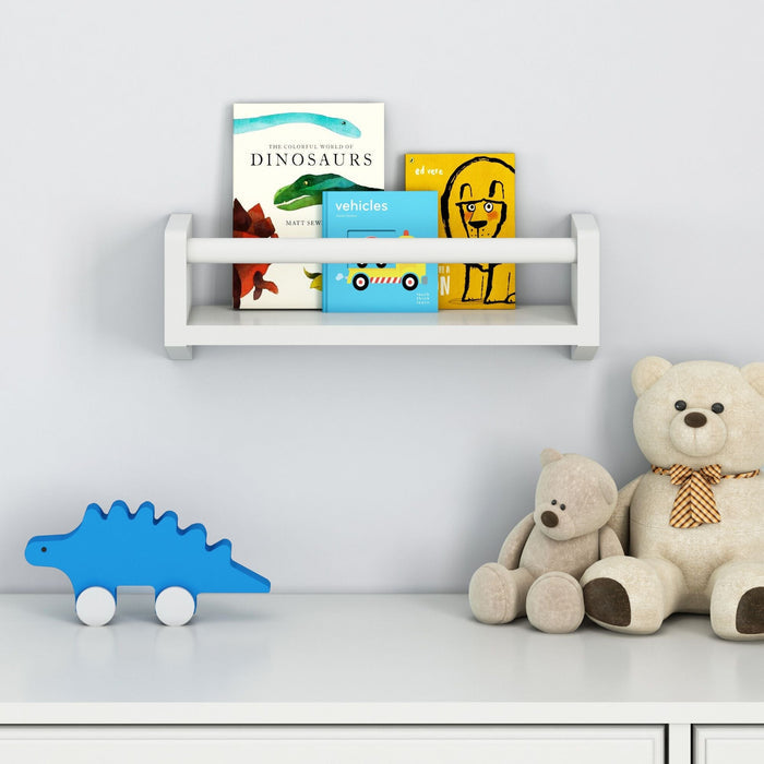 Children's room shelf with books, plush teddy bears, and blue dinosaur toy for nursery decor.