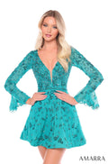 A model wears a jade green, long-sleeved mini dress with intricate beaded embellishments and a plunging neckline.