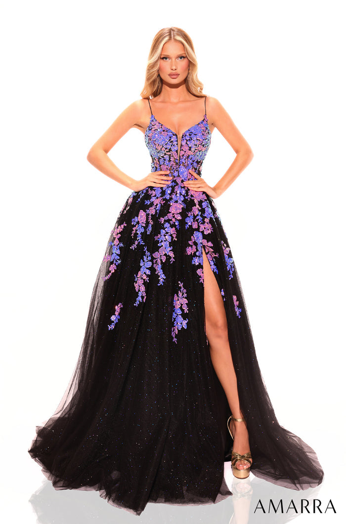 A model wears a Black/Multi floral-embellished ball gown with a high leg slit and spaghetti straps.