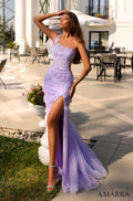 A lilac one-shoulder lace gown with a high slit, worn on an outdoor terrace with potted flowers.