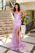 A woman wears a long lavender sequined gown with a high slit, posing on marble stairs with an ornate railing.