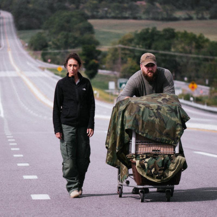 Survival Bug Out DVD or USB showing two people with camo gear on roadside featuring custom kit builds and service A Way Through the Wilderness